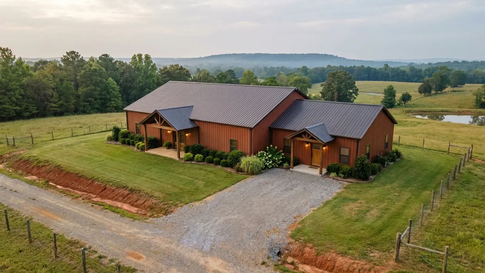 A barndominium with a smaller attached in-law suite wing that has its own separate covered entry, distinct from the main entry.