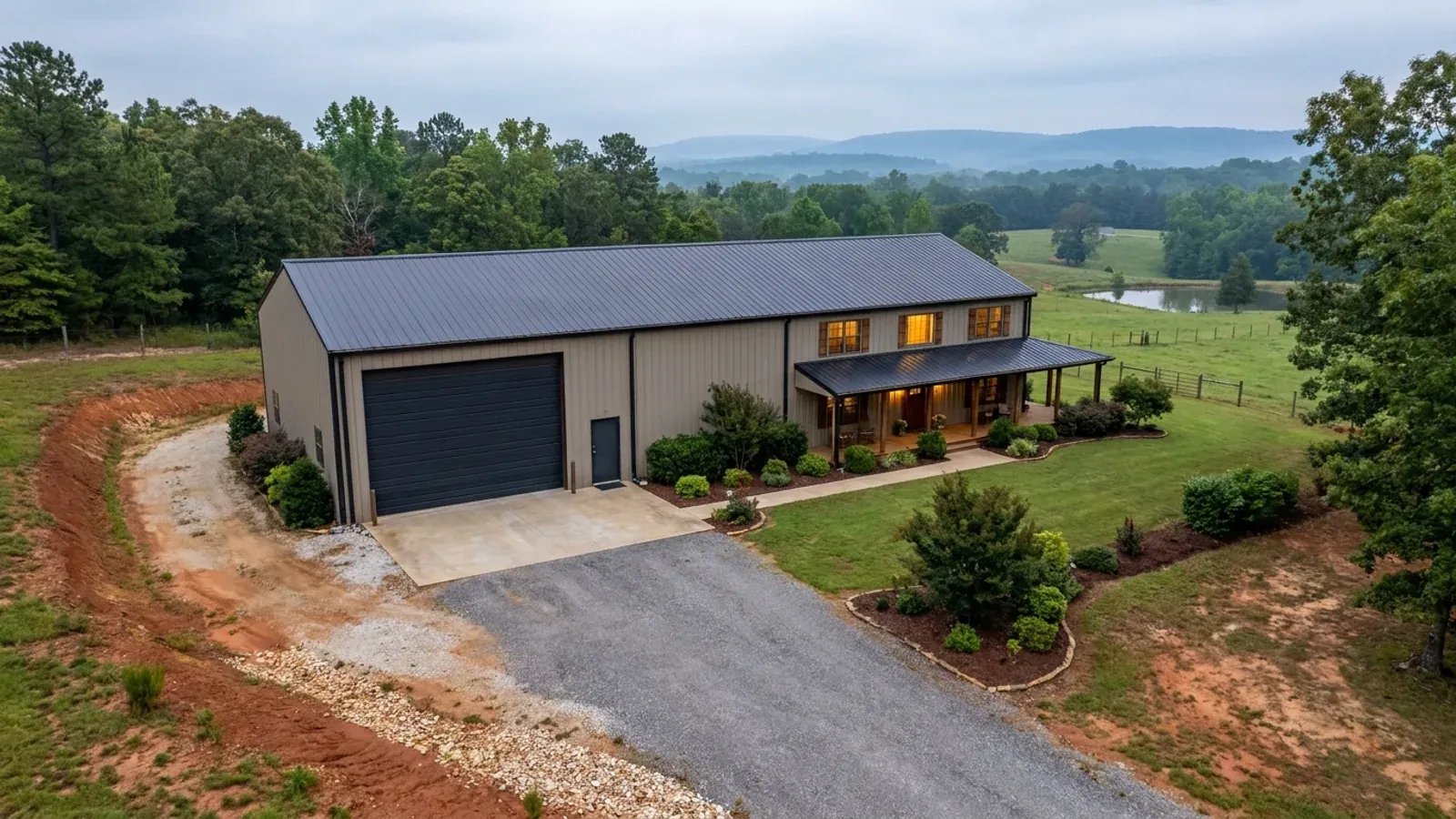 A barndominium with a tall, deep RV garage bay attached to the residence under one continuous roof.