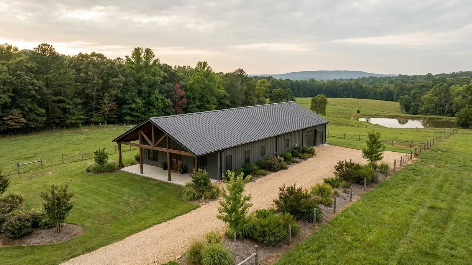 A completed single-story barndominium with a long, low roofline and no upper-level windows.
